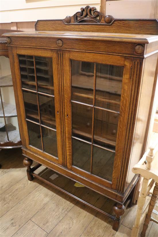 A 1930s oak display cabinet, W.96cm